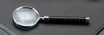 Chrome plated magnifying glass with leather handle
